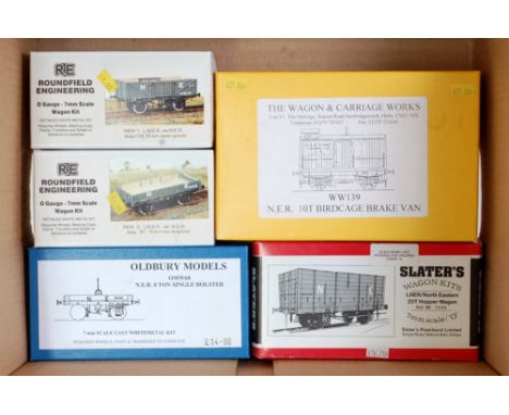 Five assorted wagon kits including 'The Carriage &amp; Wagon Works' NER 10 ton birdcage brake van, Roundfield Engineering 12 