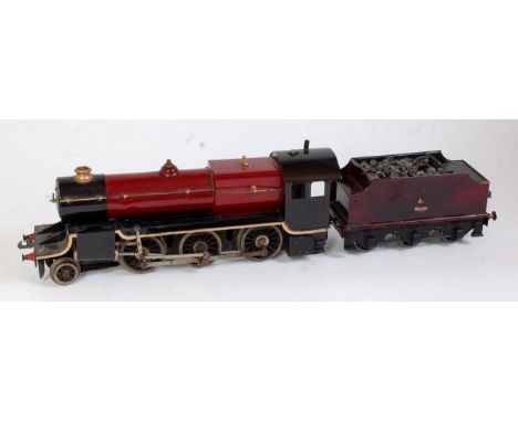 A Bassett Lowke steam, spirit fired 2-6-0 engine and tender sold for spares or repair (A/F)