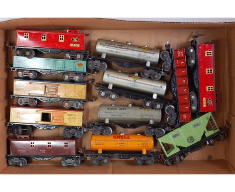 Twelve assorted Lionel bogie goods wagons including 4 tanks, 5 box cars, 2 open and a hopper (G)