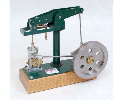 A kit built stationary beam engine comprising of a hand painted dark green body, with single cylinder fitted with slip eccent
