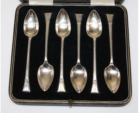 A set of six Art Deco silver spoons possibly for grapefruit or melon, cased, Sheffield 1935, British patent registration numb