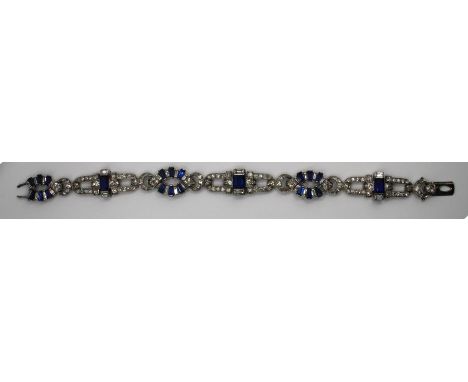 An Art Deco sapphire and diamond bracelet of marquise and lozenge shape openwork links with three prominent rectangular&nbsp;