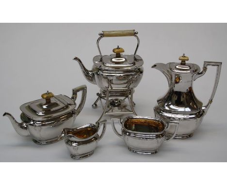 A six piece silver and ivory tea/coffee set, the oblong bodies with discreet Art Nouveau decoration, comprising a teapot, cof