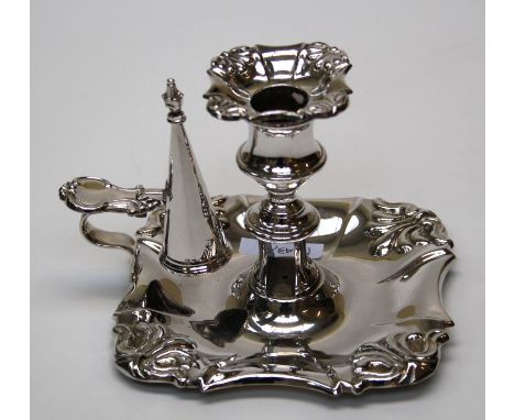 A late George IV silver chamberstick and snuffer, the near square base with embossed anthemion decoration to the corners, She