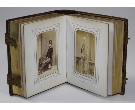 An Edwardian leather bound studio portrait photograph album with pierced gilt metal clasps, containing fifty images, 8vo