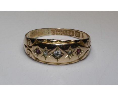 A 15ct gold hallmarked dress ring (1920's) gypsy set melee diamonds x 3 and small rubies x 2, size M, approx. gross weight 2.