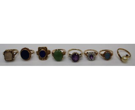 A 9ct ring set oval amethyst and three small brilliant cut diamonds to each shoulder and seven other 9ct rings set various ge
