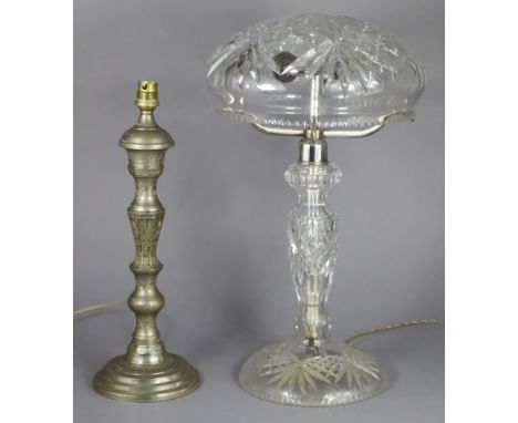 A 20th century cut-glass table lamp with ‘bowl’ shade supported by three silvered-metal antler-shaped arms, on round pedestal