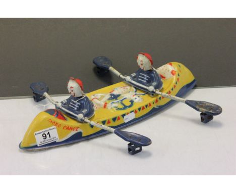 Tinplate Mobo Canoe model of rowing Clowns, marked "Made in England" to base