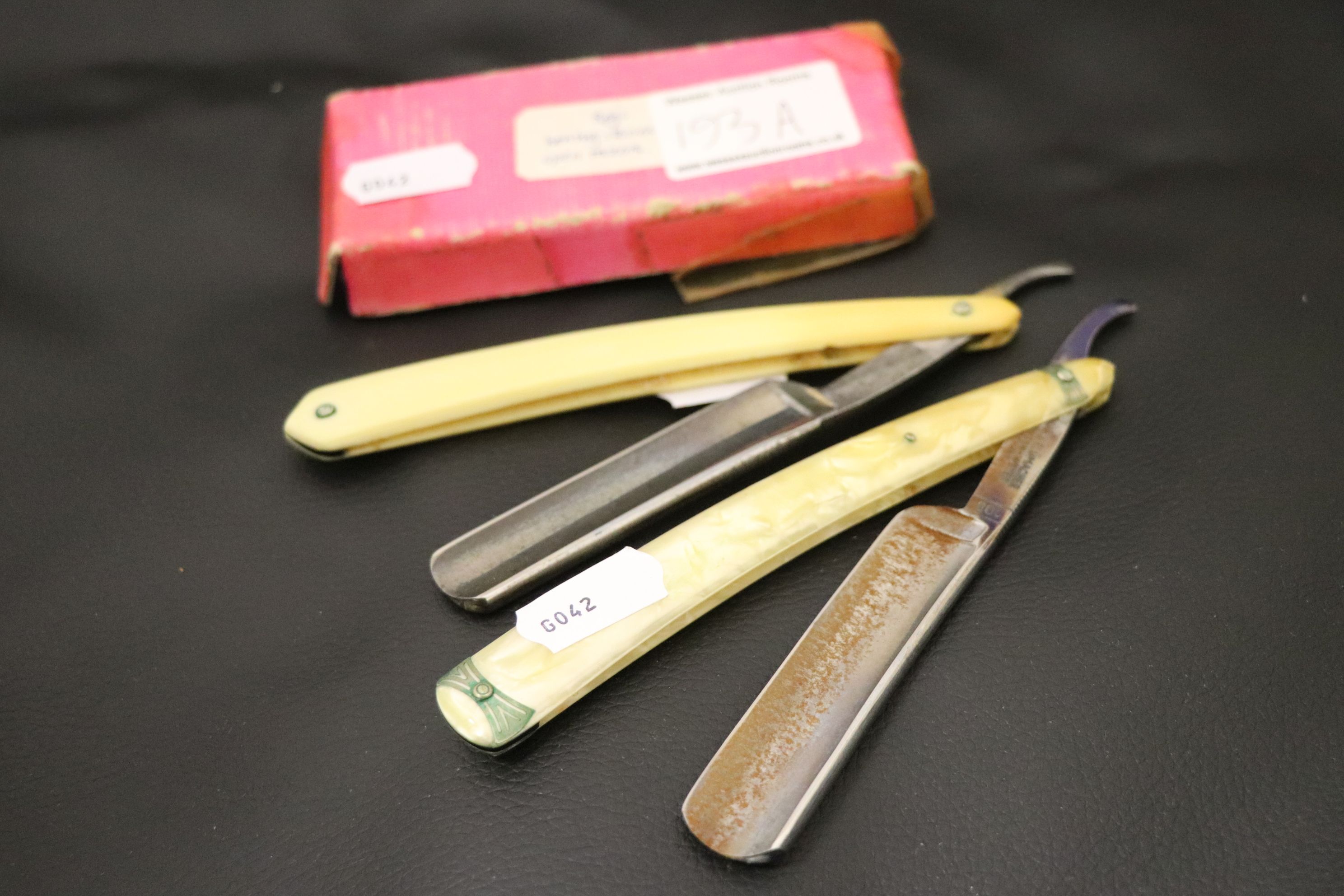 Two vintage cut throat Razors and a sharpening stone