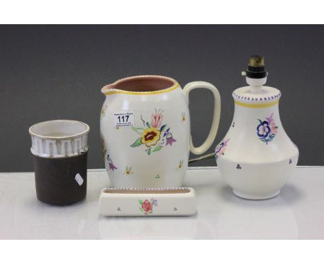 Four vintage Poole pottery items to include a large jug and a Poole Studio vase