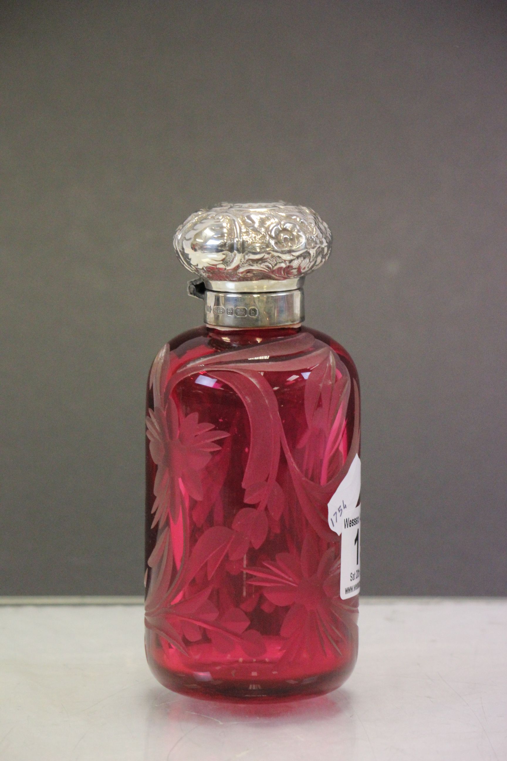 Large engraved Cranberry glass Cologne bottle with hallmarked Silver