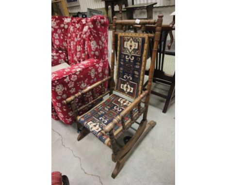 19th century Walnut American Rocking Chair upholstered with Native American Carpet Back and Seat