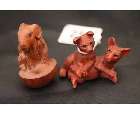 Two wooden netsuke carvings to include a Ram and Two Dogs