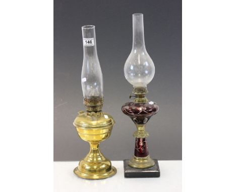 Two vintage Oil lamps, one with engraved Ruby glass overlay decoration
