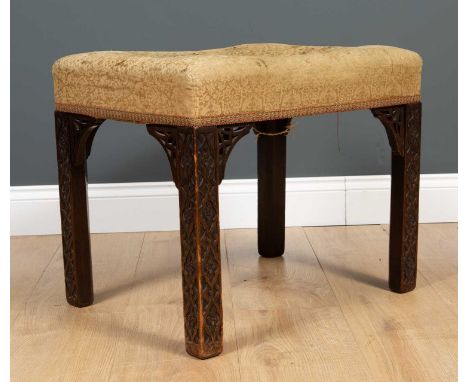 An antique Chippendale style stool with an upholstered seat and square legs with blind fretwork decoration, 54cm wide x 40cm 