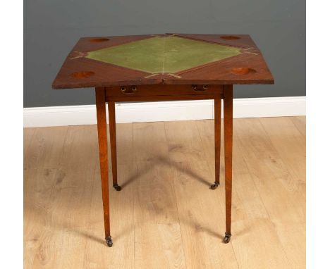 An Edwardian mahogany envelope card table with a rotating and folding top, a green baize and a single drawer, having square t