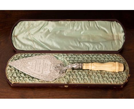 Late Victorian silver engraved presentation trowel with decorative turned and carved facetted ivory handle in leatherette cas