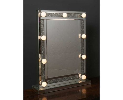 A green room make-up mirror the central rectangular mirror plate surrounded by inset diamonte slips and mounted with nine lig