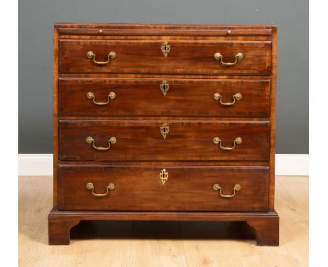 A George III mahogany caddy topped chest with brushing slide over four graduated drawers and with crossbanded decoration to t