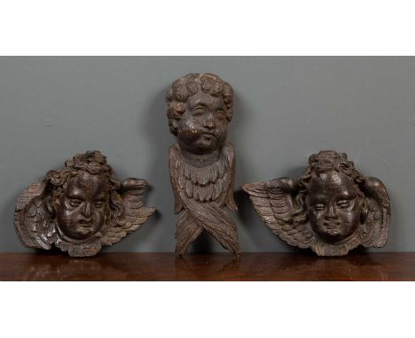 Architectural elements, a group of three 18th century oak carved fragments possibly from an altarpiece depicting two cherubs 
