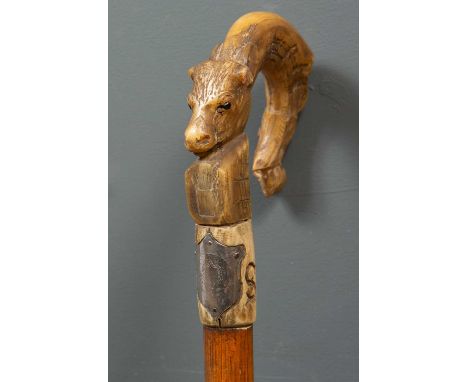 A hand carved bone handled character walking stick with engraved farmer and cow, etched with initials WS, 92cm highSurface ma