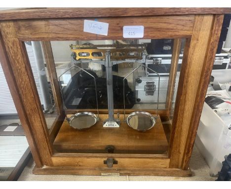 A cased &amp; glazed set of chemist scales 43cm x 46cm. No shipping. 