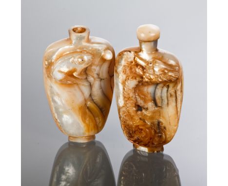 TWO CHINESE MOTHER OF PEARL SNUFF BOTTLES 
with animals in relief, 8.5cm high 