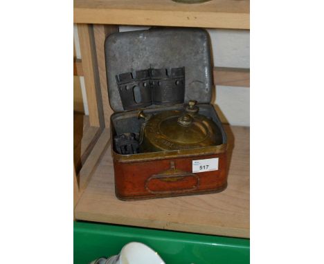 Collectors tin and a paraffin lamp