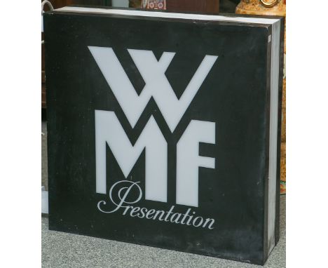 Leuchtkasten / Werbeschild "WMF Presentation", elektrifiziert, m. Wandmontierung, ca. 70,5x 81 x 19,5 cm. Wohl funktionsfähig