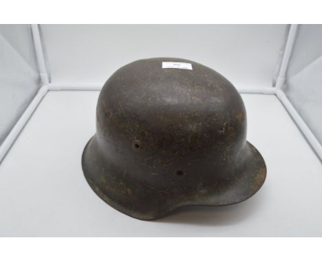 Stahlhelm "M42" (2. WK, Drittes Reich), Originalzustand, Adler m. Hakenkreuz erkennbar,innen unleserl. gestempelt. Ohne Innen