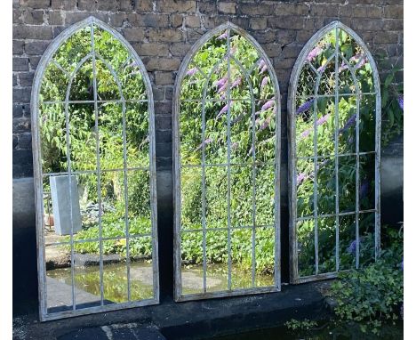 ARCHITECTURAL GARDEN WALL MIRRORS, a set of three, 159cm x 56cm. (3) 