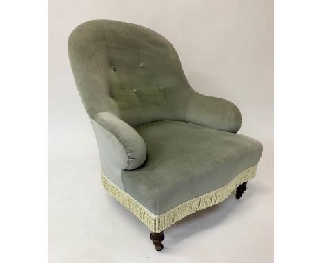 SLIPPER ARMCHAIR, Victorian green velvet upholstered with button back, tassel and turned supports, 66cm W. 