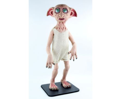 Harry Potter - A freestanding life size display prop of Dobby. The figure is made of a solid inner skeleton structure with ha