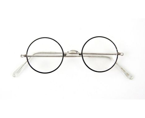 Harry Potter and the Philosopher's Stone (2001) - Daniel Radcliffe as Harry Potter, a pair of silver metal wire frame glasses