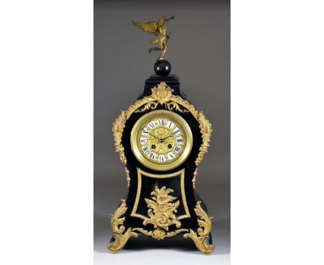 A 19th Century French Ebonised and Gilt Metal Mounted Mantel Clock of 18th Century Design, the 4.5ins diameter gilt dial with