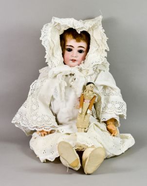 An Armand Marseille Bisque-Headed Doll of Large Proportions, Late 19th/Early 20th Century, 25ins high, with auburn wig, sleep