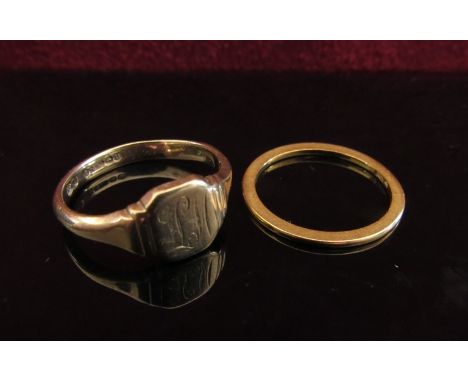 A gold wedding band, marks rubbed, 1mm wide. Size M/N, 1.7g and a 9ct gold signet ring. Size P/Q, 3.5g