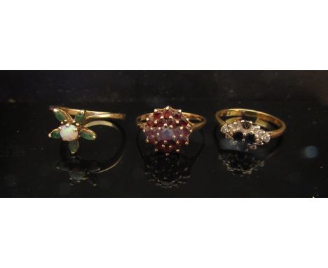 Three gold rings including 9ct gold cluster 2.3g, 18ct gold sapphire and diamond, stone missing, size Q, 3.3g and an opal and