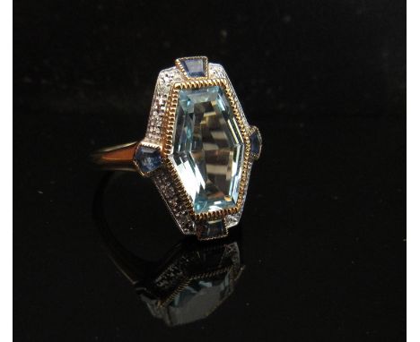 A 9ct gold aquamarine, sapphire and diamond chip ring. Size M/N, 4.3g