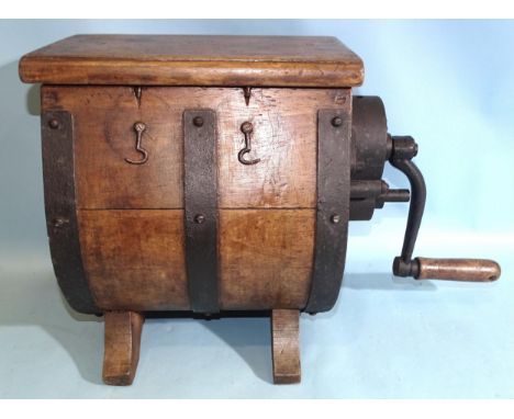 An early-20th century mechanical hand-cranked butter churn&nbsp;of metal-bound barrel form, 35cm high.