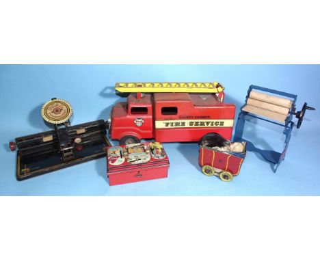 A tinplate "Dial Typewriter", 25.5cm, a 'Remanco' toy mangle, a Wells O'London tinplate pram (a/f), a lithographed tinplate c