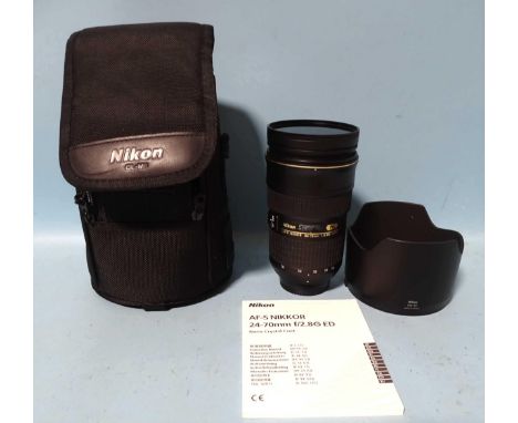 A Nikon AF-S Nikkor 24-70mm 1:2.8 G ED lens, serial number:234463, with HB-40 lens hood, Nikon CL-M3 lens case and user's man