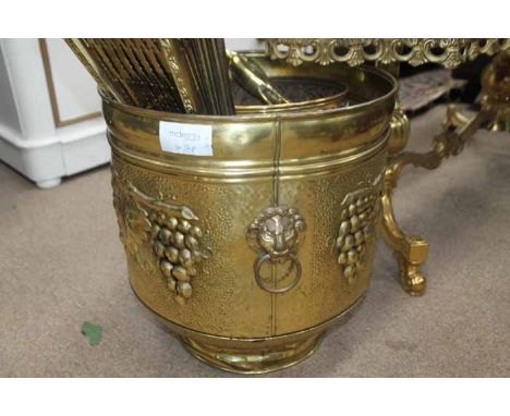 EMBOSSED BRASS LOG BIN also an embossed and copper fruit bowl, two brass figures of cranes and a brass fan shaped firescreen 