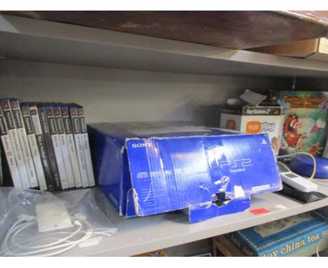 PlayStation2 games, a PS2 console, an iPod shuffle, a Creative adaptor and other items 