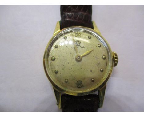 An Omega ladies manual wind 18ct gold wristwatch, case back weighing 2.1g on an Asprey leather strap 