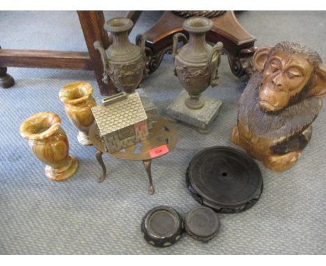 A Retro metallic Noddy moneybox, three Oriental hardwood stands, a pair of onyx vases, a pair of clock vase garnitures on mar