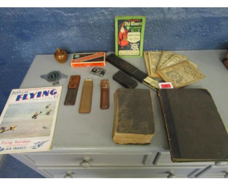 A mixed lot to include a Bentley Drivers Club car badge, a K.K.W miniature camera/lighter, slide rule, Mrs Beeton Household M