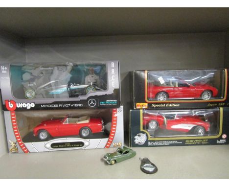 A group of model diecast collectors cars to include a Burago Mercedes F1 WD7 Hybrid, a Road Signature 1958 Aston Martin DB2-4