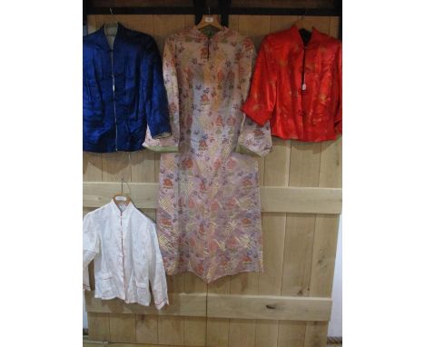 Four items of mid to late 20th century Chinese export clothing to include two silk jackets, an embroidered dress and a mandar